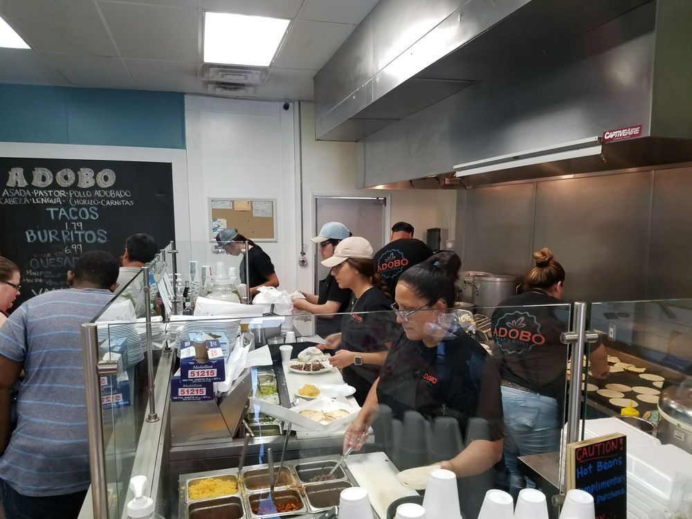 Adobo Taco Grill counter and staff